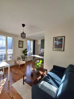 Coin salon dans l'établissement Eiffel Tower family apartment