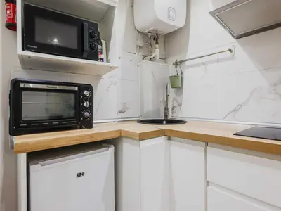 Cuisine ou kitchenette dans l'établissement Cosy Studio - 2P - Canal Saint Martin