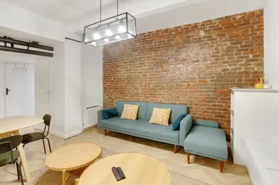 Coin salon dans l'établissement Charmant cocon design 1BR - Proche Montmatre