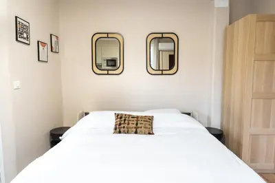 Un ou plusieurs lits dans un hébergement de l'établissement Cozy and air-conditioned studio - Daumesnil