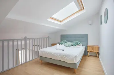 Un ou plusieurs lits dans un hébergement de l'établissement Appartement lumineux dans Paris - Climatisé