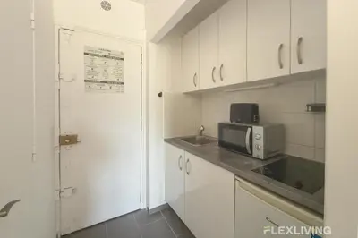 Cuisine ou kitchenette dans l'établissement Flexliving - Studio - Patriarches