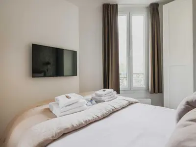 Un ou plusieurs lits dans un hébergement de l'établissement Elegant flat - 1BD 4P - Montmartre