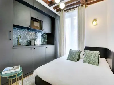 Un ou plusieurs lits dans un hébergement de l'établissement Cosy studio - 2P - 16ème métro Ranelagh