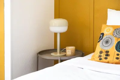 Un ou plusieurs lits dans un hébergement de l'établissement Eiffel residence Augustin