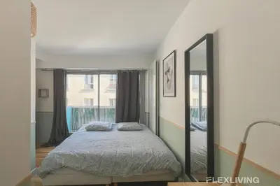 Un ou plusieurs lits dans un hébergement de l'établissement T3 3 chambres avec balcon vie animée et restos