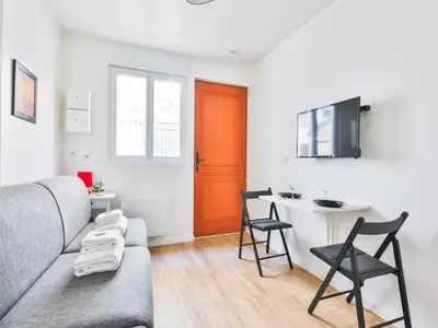 Télévision ou salle de divertissement dans l'établissement Cozy appartement -2P- Accor Arena Bercy