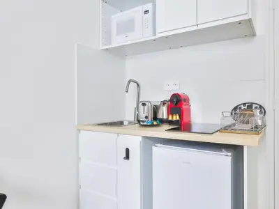 Cuisine ou kitchenette dans l'établissement Cozy appartement -2P- Accor Arena Bercy