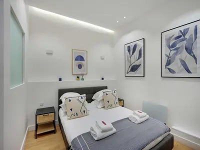 Un ou plusieurs lits dans un hébergement de l'établissement Apartment for 2 people in Bastille