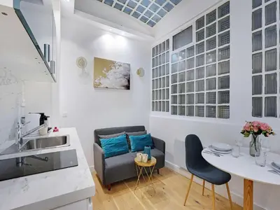 Coin salon dans l'établissement Apartment for 2 people in Bastille