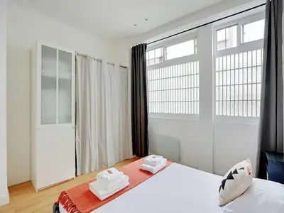 Un ou plusieurs lits dans un hébergement de l'établissement Apartment in Bastille with 1 room