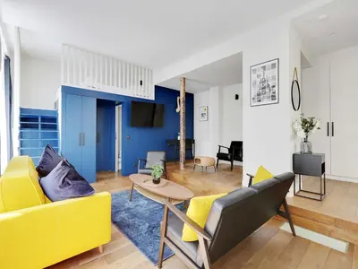 Coin salon dans l'établissement Authentic Loft - 2BR 8P - Oberkampf