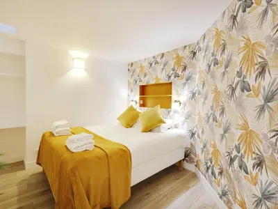 Un ou plusieurs lits dans un hébergement de l'établissement Authentic Loft - 2BR 8P - Oberkampf