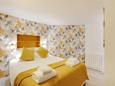 Un ou plusieurs lits dans un hébergement de l'établissement Authentic Loft - 2BR 8P - Oberkampf