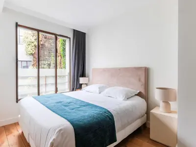 Un ou plusieurs lits dans un hébergement de l'établissement Newly renovated Loft Bastille