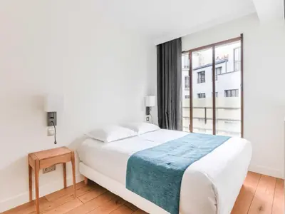 Un ou plusieurs lits dans un hébergement de l'établissement Newly renovated Loft Bastille