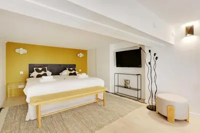 Un ou plusieurs lits dans un hébergement de l'établissement Duplex Cosy Canal Saint Martin