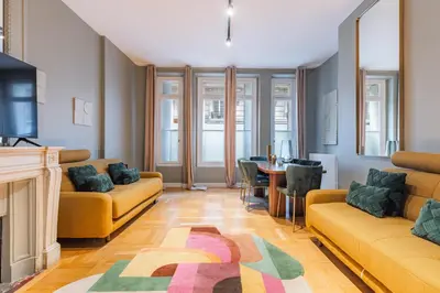 Coin salon dans l'établissement Élégant appartement 1BR - 16ème arrondissement