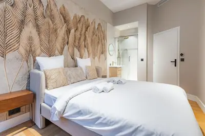 Un ou plusieurs lits dans un hébergement de l'établissement Élégant appartement 1BR - 16ème arrondissement