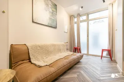 Coin salon dans l'établissement MBA - Splendide appartement Proche Marais