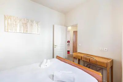 Un ou plusieurs lits dans un hébergement de l'établissement GuestReady - Luxury Living in the Heart of Paris