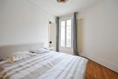 Un ou plusieurs lits dans un hébergement de l'établissement Apartment Suite Parties 17