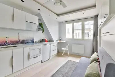 Cuisine ou kitchenette dans l'établissement Chic Studio near Arc de Triomphe
