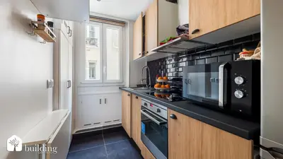 Cuisine ou kitchenette dans l'établissement App à 5 minutes de la Tour Eiffel