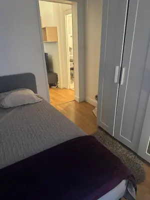 Un ou plusieurs lits dans un hébergement de l'établissement Bel Appartement Paris 11