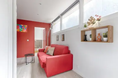 Coin salon dans l'établissement Charming Gambetta Saint Fargeau I apartment