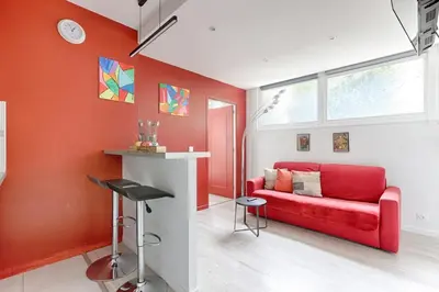 Coin salon dans l'établissement Charming Gambetta Saint Fargeau I apartment