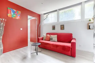 Coin salon dans l'établissement Charming Gambetta Saint Fargeau I apartment