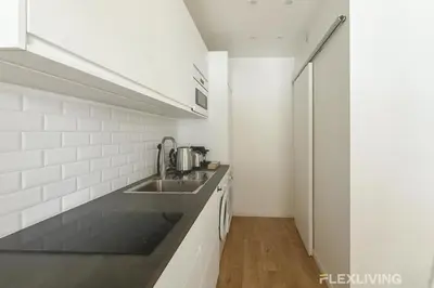 Cuisine ou kitchenette dans l'établissement Dans l'incontournable Montmartre T2 cosy & central