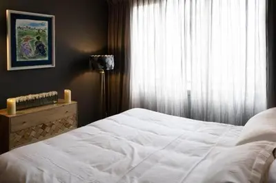 Un ou plusieurs lits dans un hébergement de l'établissement Amazing appartements on Champs-Elysées