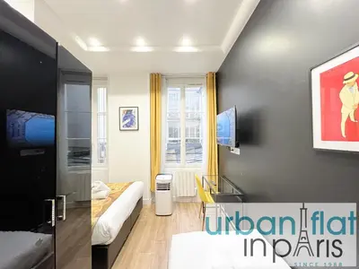 Télévision ou salle de divertissement dans l'établissement UrbanFlat 156 - Yves Apartment Saint Denis