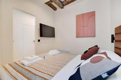 Un ou plusieurs lits dans un hébergement de l'établissement Les Halles - Grands Boulevards Cozy 1BR - 4P
