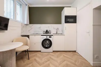 Cuisine ou kitchenette dans l'établissement Charmant studio à Pigalle