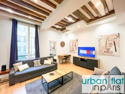 Coin salon dans l'établissement Urban Flat 67 - Spacious Flat in Central Paris
