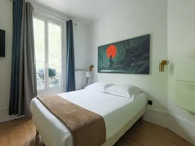 Un ou plusieurs lits dans un hébergement de l'établissement Charming 1BR - 2P Apartment Gateway to Paris