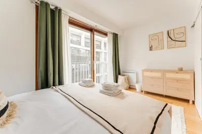 Un ou plusieurs lits dans un hébergement de l'établissement Trocadero 1Bedroom 4 people