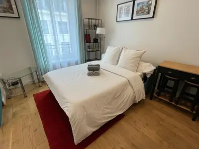 Un ou plusieurs lits dans un hébergement de l'établissement Paris 2 - Vendôme - Rue Volney - 2 rooms