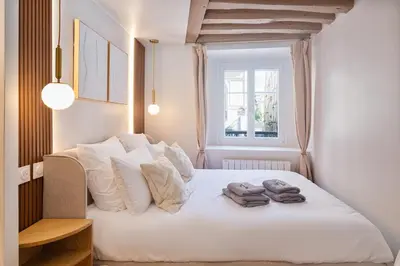 Un ou plusieurs lits dans un hébergement de l'établissement Louvre - Rivoli - Designer Studio - Sleeps 3P
