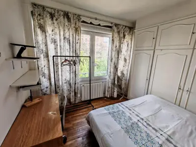 Un ou plusieurs lits dans un hébergement de l'établissement Cozy Apartment Montrouge Paris