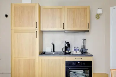 Cuisine ou kitchenette dans l'établissement Appartment haut de gamme en plein coeur de Paris