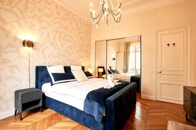 Un ou plusieurs lits dans un hébergement de l'établissement Spacious flat - Champs Elysées