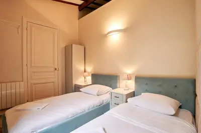 Un ou plusieurs lits dans un hébergement de l'établissement Spacious flat - Champs Elysées