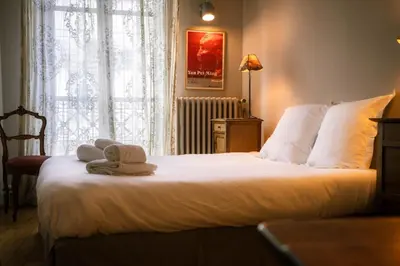 Un ou plusieurs lits dans un hébergement de l'établissement L'Aneto - Charme Balcon Home-cinema
