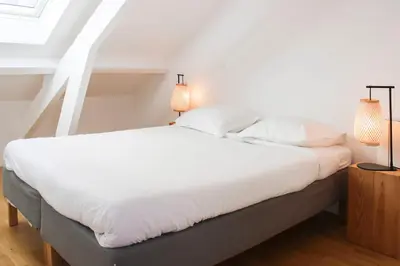 Un ou plusieurs lits dans un hébergement de l'établissement Duplex cosy au cœur du Marais Paris 3ᵉ