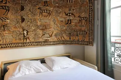 Un ou plusieurs lits dans un hébergement de l'établissement Duplex cosy au cœur du Marais Paris 3ᵉ