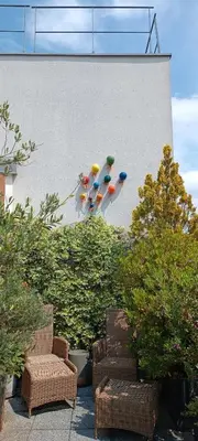 Coin salon dans l'établissement Stade de France - Magnifique terrasse arborée